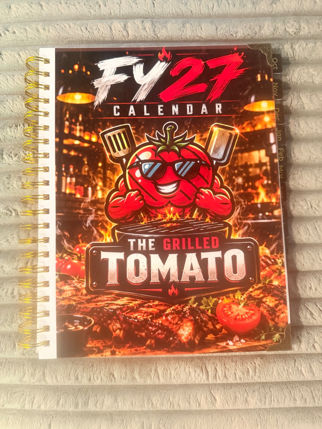 The Grilled Tomato FY27 calendar design example